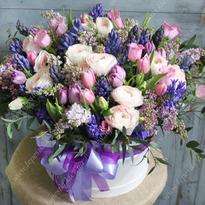 Big box with lilacs and hyacinths