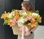 Large basket of flowers with lily and rose