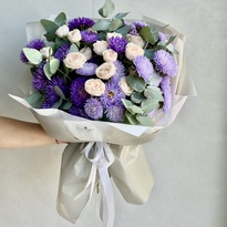 Autumn bouquet with asters and roses