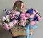 Basket with peonies and delphinium
