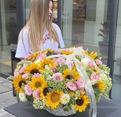 Large basket of sunflowers and seasonal flowers
