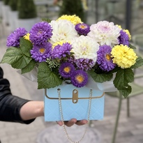 Composition in a blue handbag